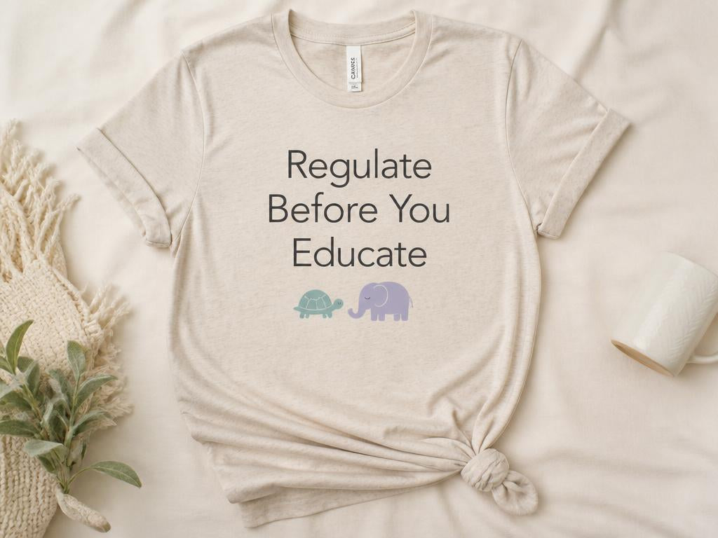 Heather sand adult tee printed with Regulate Before You Educate and a turtle and elephant