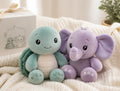 Tommy Turtle and Ellie the Elephant plush gift set on a cream blanket